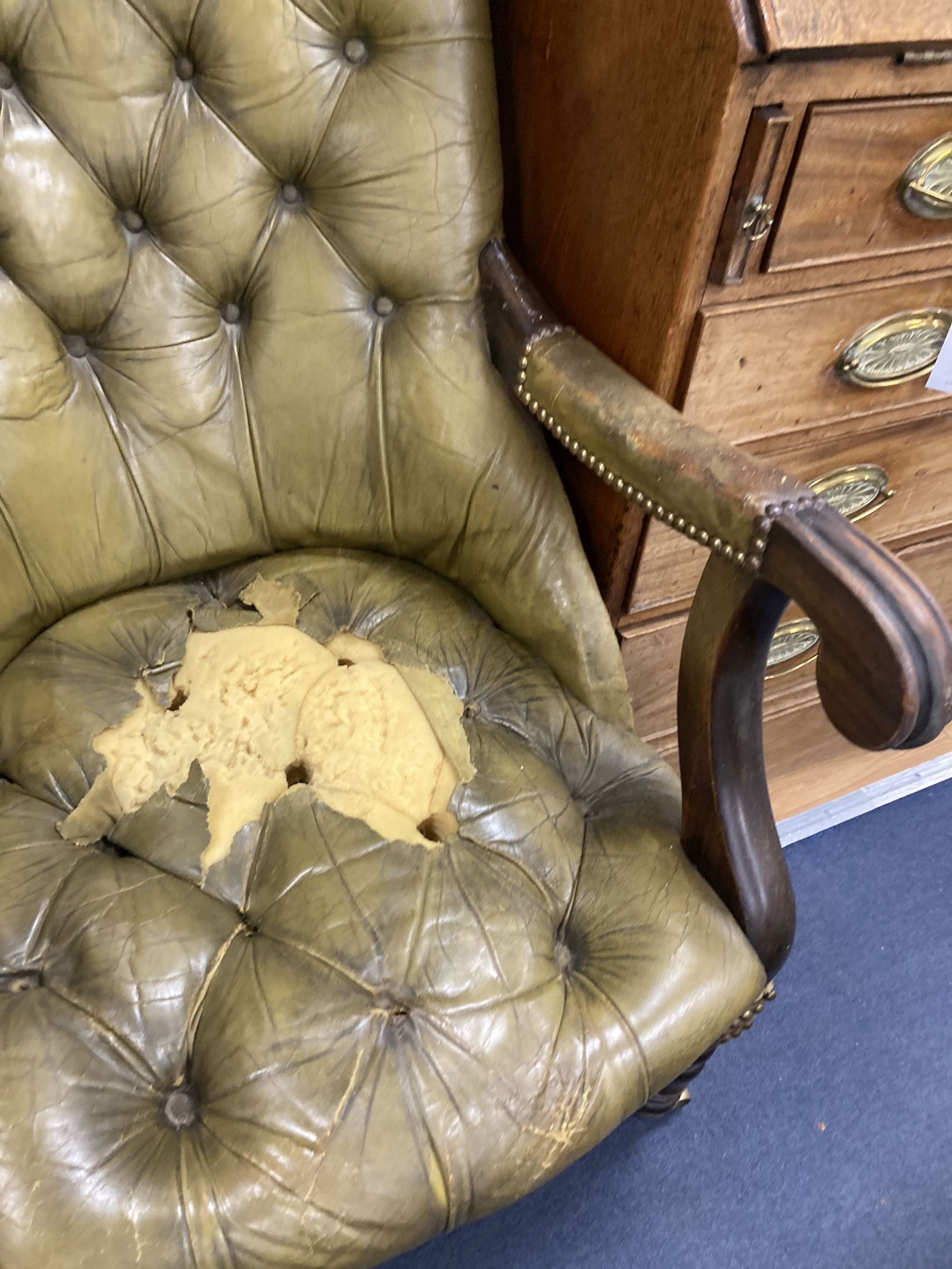 An early Victorian mahogany library armchair, upholstered in pale green leather, width 59cm, depth 84cm, height 104cm